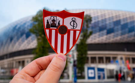 September 12, 2021, Seville, Spain. The emblem of the football club Sevilla FC against the background of a modern stadium.のeditorial素材