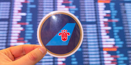 December 11, 2021, Guangzhou, China. The emblem of China Southern Airlines against the background of...