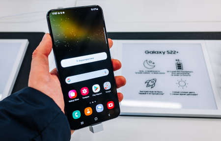 February 15, 2022, Moscow, Russia. The new Samsung Galaxy S22+ mobile phone in a store window.のeditorial素材
