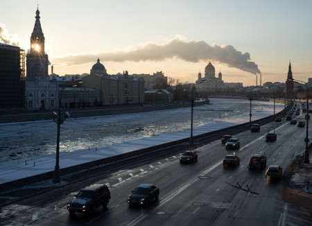 January 18, 2014, Moscow, Russia. Automobile traffic on the Kremlin embankment in Moscow. And an ice-covered river.のeditorial素材