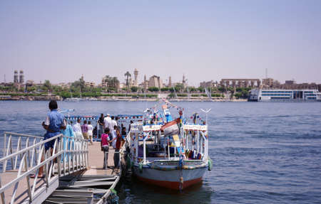 August 20, 2021 Luxor, Egypt. Passengers boarding a pleasure boat on the Nile River in Luxor.