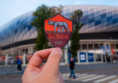 September 12, 2021, Rome, Italy. AS Football Club emblem Roma against the backdrop of a modern stadium.のeditorial素材