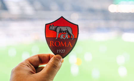 September 12, 2021, Rome, Italy. AS Football Club emblem Roma against the backdrop of a modern...
