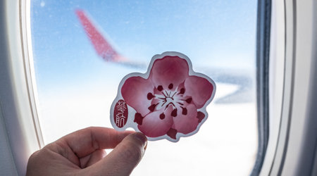 December 6, 2021 Taiwan, Taoyuan. The emblem of the airline China Airlines on the background of the window of the aircraft.のeditorial素材