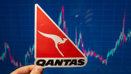 November 10, 2021 Sydney, Australia. The Qantas airline emblem against the backdrop of a stock price chart.のeditorial素材