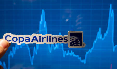 November 10, 2021, Panama. Copa Airlines emblem against the background of a stock price chart.のeditorial素材
