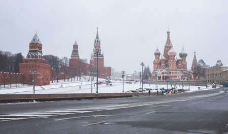 December 5, 202, Moscow, Russia. View of Vasilyevsky Spusk, the Moscow Kremlin and St. Basil's Cathedral in winter during a snowfall.のeditorial素材