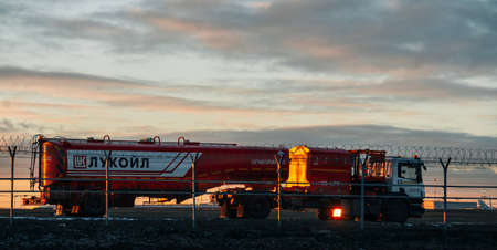 November 23, 2018, Moscow, Russia Tanker of the oil company "Lukoil" on the airfield of Sheremetyevo airport at sunset.のeditorial素材