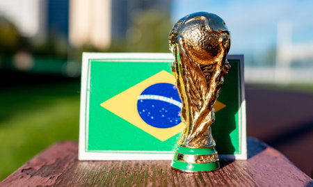 September 2, 2021, Moscow, Russia. The FIFA World Cup against the background of the flag of Brazil...