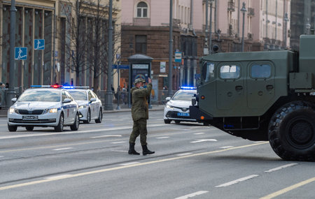 April 29, 2021 Moscow, Russia. A serviceman of the Military Automobile Inspection regulates the movement of Tverskaya Street during the rehearsal of the parade.のeditorial素材