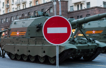 April 30, 2021 Moscow, Russia. Russian 152 mm artillery complex 2S35 Koalitsiya-SV and road sign no traffic on Tverskaya Street in Moscow.のeditorial素材