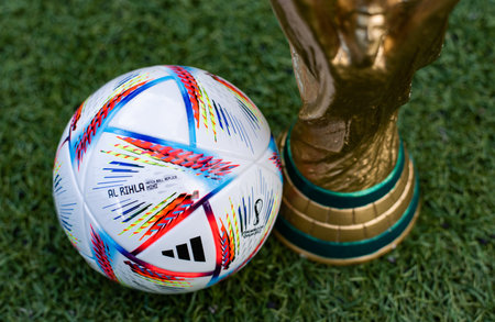 September 3, 2022, Doha, Qatar. FIFA World Cup and official Adidas Al Rihla ball on the green lawn of the stadium.のeditorial素材
