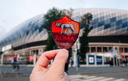 September 12, 2021, Rome, Italy. AS Football Club emblem Roma against the backdrop of a modern stadium.のeditorial素材