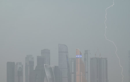 July 21, 2022, Moscow, Russia. Lightning near the skyscrapers of the Moscow city business center...