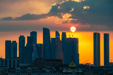 August 16, 2022, Moscow, Russia. The setting sun over the skyscrapers of the Moscow City office center on a summer evening. Sunset.のeditorial素材