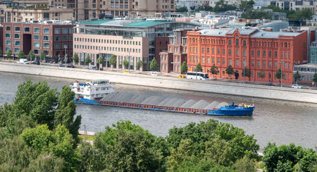 July 16, 2022, Moscow, Russia. A barge with rubble on the Moscow River in the center of the Russian capitalのeditorial素材