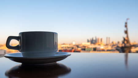 A cup of coffee on a table in a summer cafe with a panoramic view of the center of the Russian capitalの写真素材