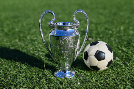 September 27, 2023, London, United Kingdom. The UEFA Champions League Cup on the green lawn of the stadium.のeditorial素材