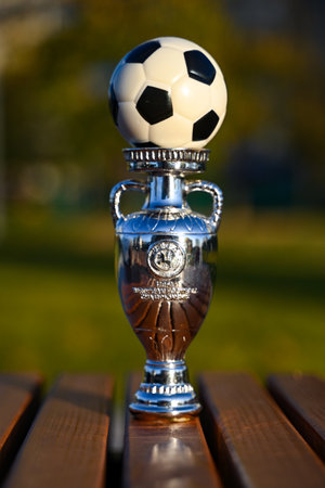 October 13, 2023, Berlin, Germany. The trophy of the European Football Championship and a soccer ball.のeditorial素材