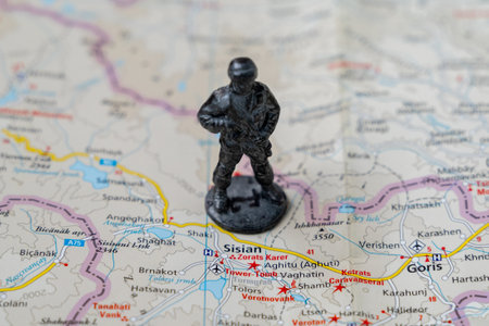 A metal toy soldier stands on the map of the Syunik region of Armeniaのeditorial素材