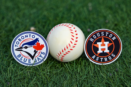 October 3, 2023, Baltimore, United States. Emblems of baseball clubs participating in the 2023 playoffs of the Toronto Blue Jays and Houston Astros on the green law of the stadium.のeditorial素材