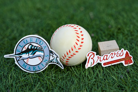 October 3, 2023, Baltimore, United States. The emblems of the baseball clubs participating in the 2023 playoffs of the Atlanta Braves and Miami Marlins on the green law of the stadium.のeditorial素材