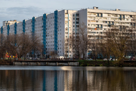 Multi-storey residential complex on the river bank in a residential areaの写真素材