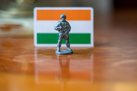 A tin soldier on the background of the Indian flag. India Pakistan military conflictの写真素材