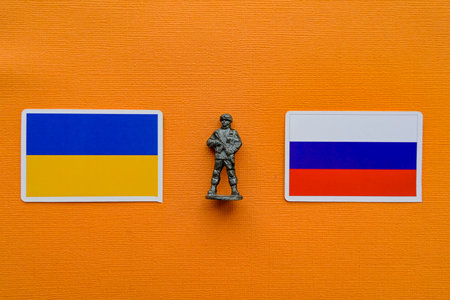 Flags of Russia and Ukraine on a yellow background. The Russian-Ukrainian conflict.