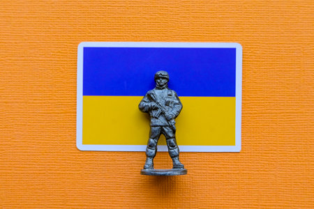 Flags of Ukraine on a yellow background. The Russian-Ukrainian conflict.の写真素材