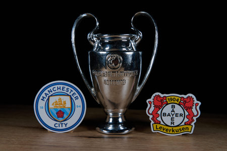 October 7, 2025, Budapest, Hungary. The emblems of the football clubs participating in the group stage of the UEFA Champions League Manchester City and Bayer Leverkusen.