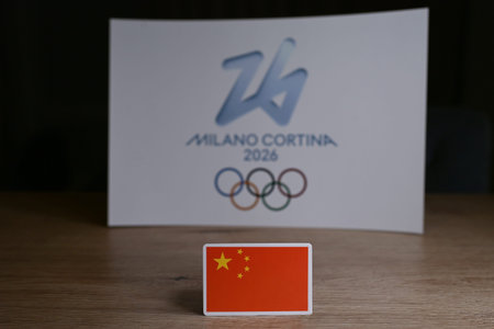 February 9, 2026. Milan, Italy. China flag on the background of the XXV Winter Olympic Games logo and commonly known as Milano Cortina 2026のeditorial素材