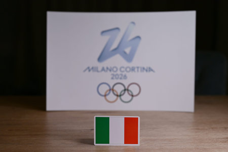 February 9, 2026. Milan, Italy. The flag of Italy on the background of the XXV Winter Olympic Games logo and commonly known as Milano Cortina 2026のeditorial素材