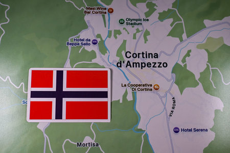 February 9, 2026, Milan, Italy. The flag of Norway on the background of the Cortina d'Ampezzo map of...