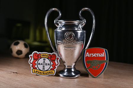 March 11, 2026, Budapest. The emblems of the football clubs participating in the Round of 16 of the UEFA Champions League are Bayer 04 Leverkusen and Arsenal F.C.