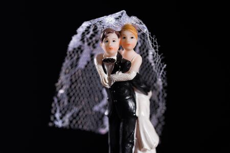 Bride and groom figures as wedding invitationの写真素材