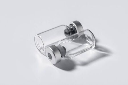 Two contrariwise ampoules symbolizing medical activityの写真素材