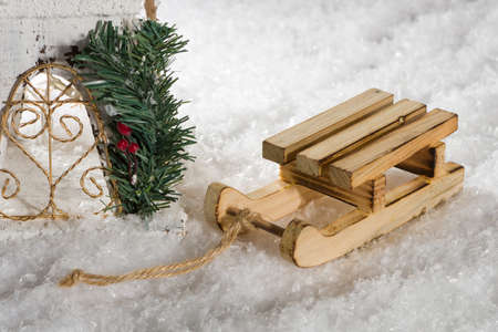 Miniature sledge on snow in front of a castle.の写真素材