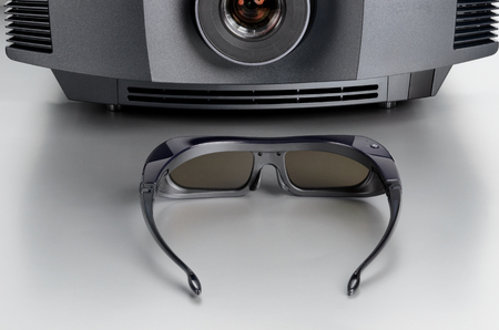 Front view of a home cinema projector with 3D-glasses.の写真素材