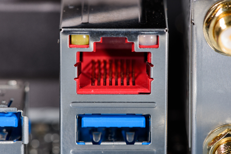 Close up on the red LAN port of a modern computer mainboard.