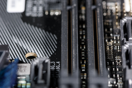 Close up on the PCI Express slots of a modern computer mainboard.