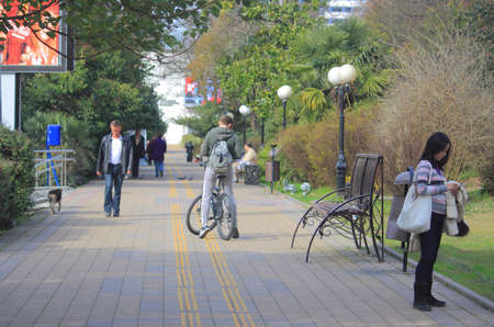 Sochi, Russia - February 14, 2014 some passerbys in park of Sochi, Russia on 14th February, 2014のeditorial素材