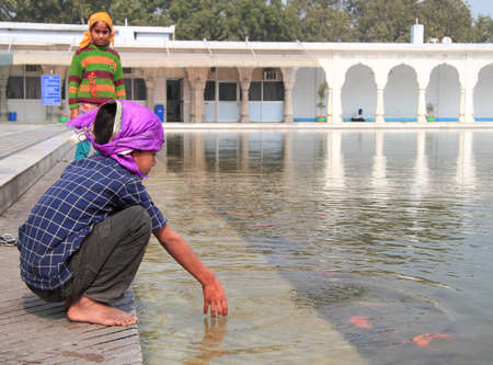 Delhi, India - February 18, 2015 children play in temple of sikhs in Delhi, India