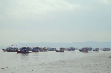 many fishing boats in suburb of Mumbai, Indiaの写真素材