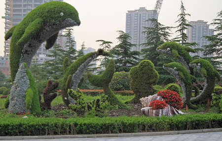 decorative composition in shape of a few dolphins in Shanghai, Chinaの写真素材