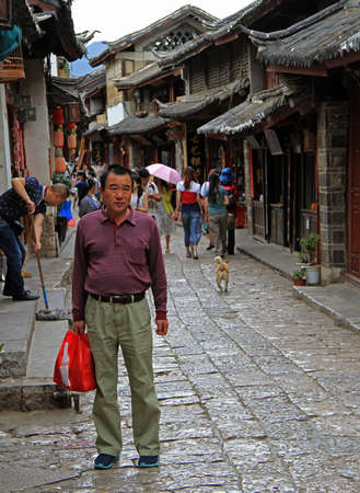 Lijiang, China - June 10, 2015: people are walking on the street in Lijiang, Chinaのeditorial素材