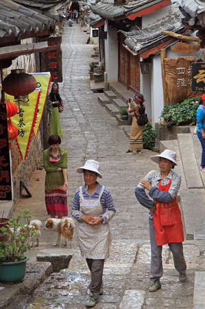 Lijiang, China - June 10, 2015: people are walking on the street in Lijiang, Chinaのeditorial素材