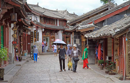 Lijiang, China - June 10, 2015: people are walking on the street in Lijiang, Chinaのeditorial素材