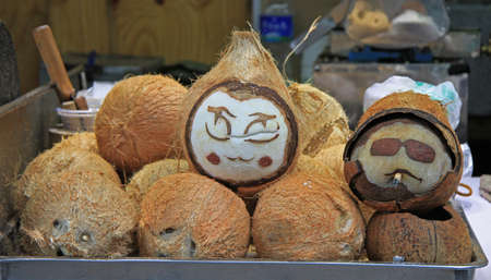 painted coconuts with faces in Lijiang, China