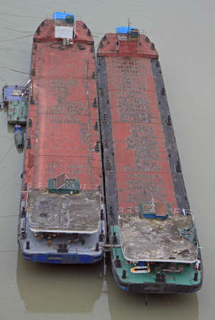 two empty container ships on river Yangtze in Chongqing, Chinaの写真素材